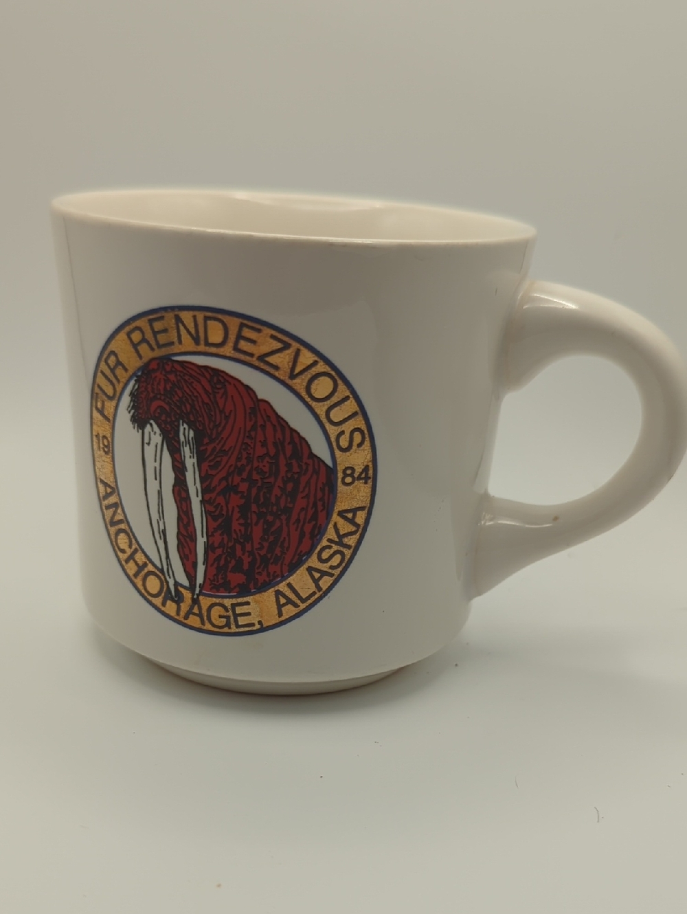 White Anchorage Walrus Logo Ceramic, 1984 Fur Rendezvous, (Fur Rowdy) Coffee Mug